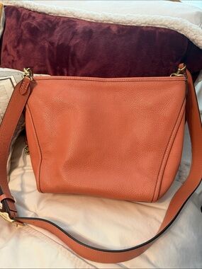 Coach Coral Pebbled Leather Dufflette crossbody bag. Adjustable strap. like new
